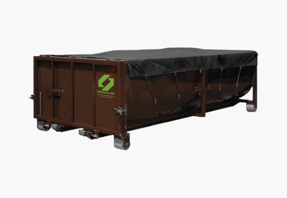 Dewatering box rental from Ironclad Environmental with a roll tarp
